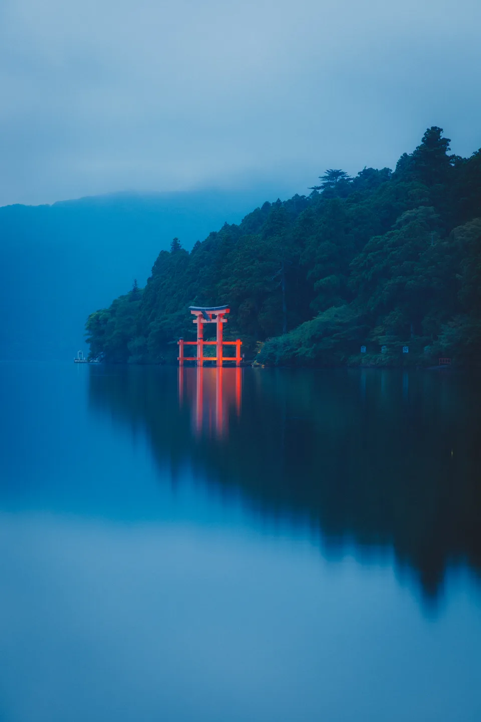 A red torii in the mist