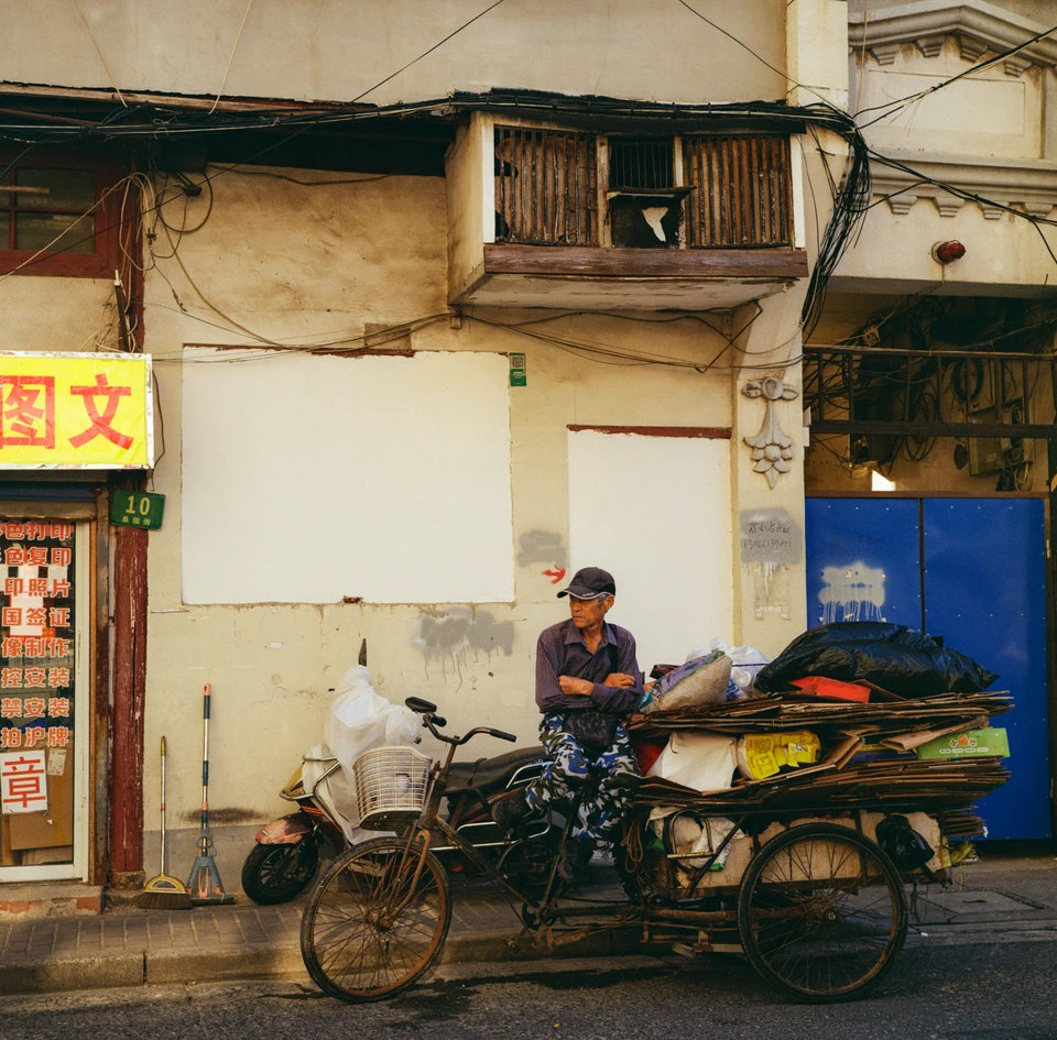 A man resting beside his cart
